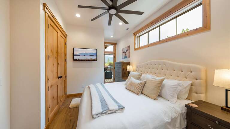 Master suite includes luxury king mattress and linens, large closet, HDTV with streaming capabilities, ensuite bathroom, access to deck with mountain views.
