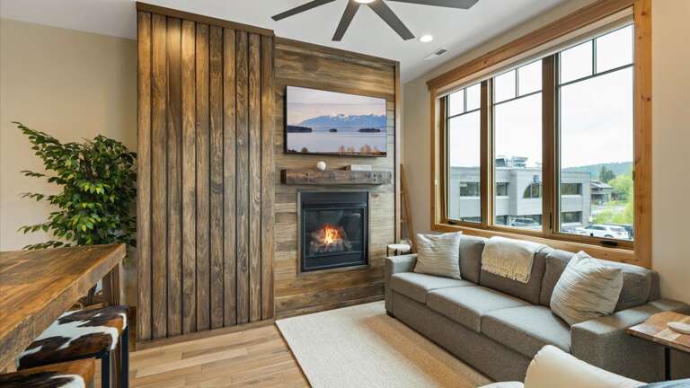 Open concept living room with gas fireplace, luxury American Leather sofa sleeper (no bars and luxury mattress), HDTV with streaming capabilities, and views of Big Mountain