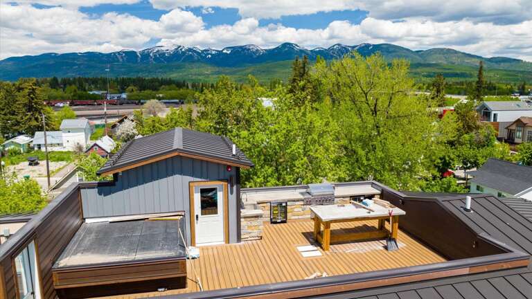 Rooftop deck area of the building which will be an outdoor kitchen and dining space for all the units to share. Construction to be completed mid-summer 2022.