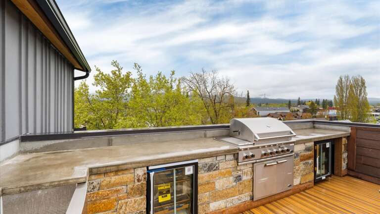 Rooftop outdoor entertaining space that is shared with the rest of the building