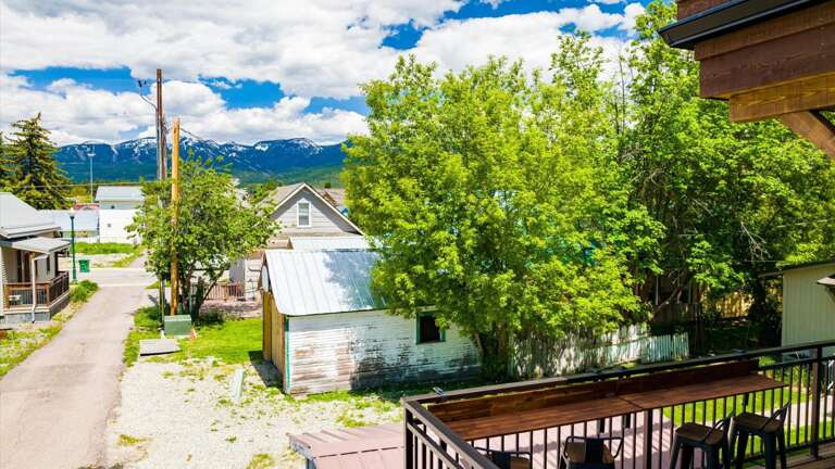 Wrap around balcony includes laptop workspace and views of Big Mountain, Weber grill with propane provided, comfy outdoor sectional to enjoy a wonderful view of the sunset.