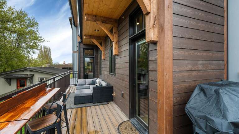 Wrap around balcony includes laptop workspace and views of Big Mountain, Weber grill with propane provided, comfy outdoor sectional to enjoy a wonderful view of the sunset.