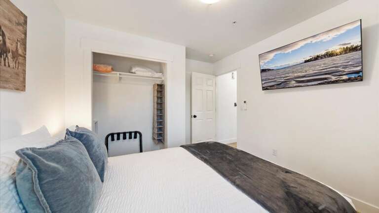 The main floor queen room features a top-of-the-line mattress