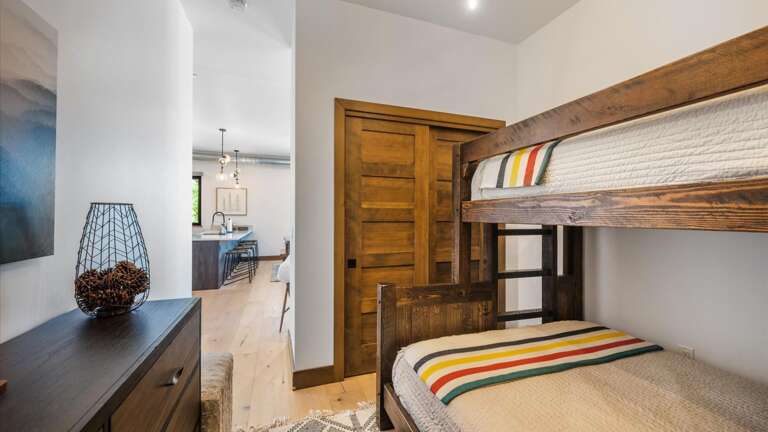 The bunk room includes a full size mattress on the bottom bunk and a twin mattress on teh top bunk. Also, there is a large closet