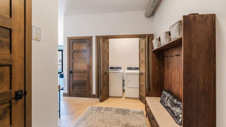 Front entryway of the condo with coat