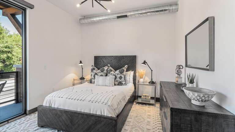 Queen guest room with walk out balcony,  luxury linens and mattress.
