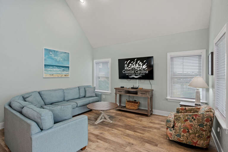 NH387C: Oak Island Cottage | Living Area, Deck Access