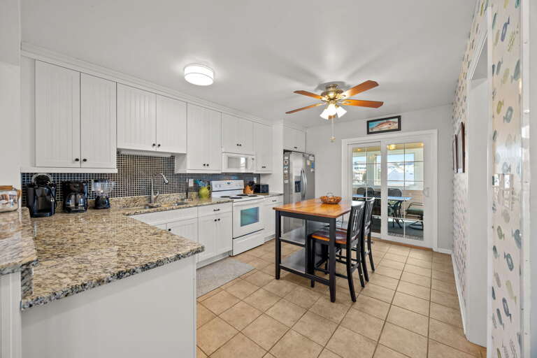 NH516: Finn Tales | TL Kitchen Area - Island seating for 2, Screened Porch Access