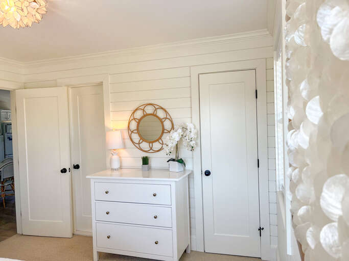 Tranquil bedroom with a queen-sized bed, great storage, and access to the modern bathroom. Tranquil bedroom with a queen-sized bed, great storage, and access to the modern bathroom.
