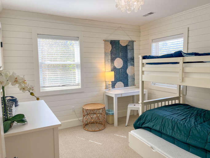 With room for everyone, enjoy this bunk room equipped with a writing desk and games for kids or adults of all ages.