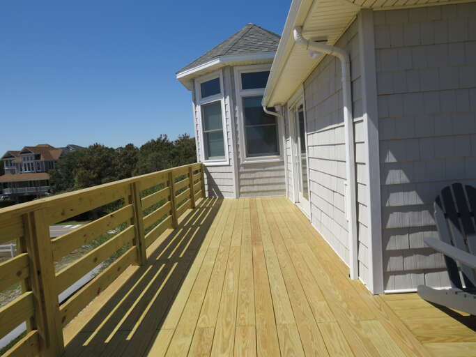 Just off the living room take in the sunrises and beach action with a bird's eye view.