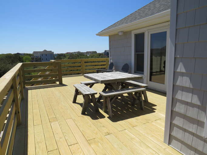 Just off the living room take in the sunrises and beach action with a bird's eye view.