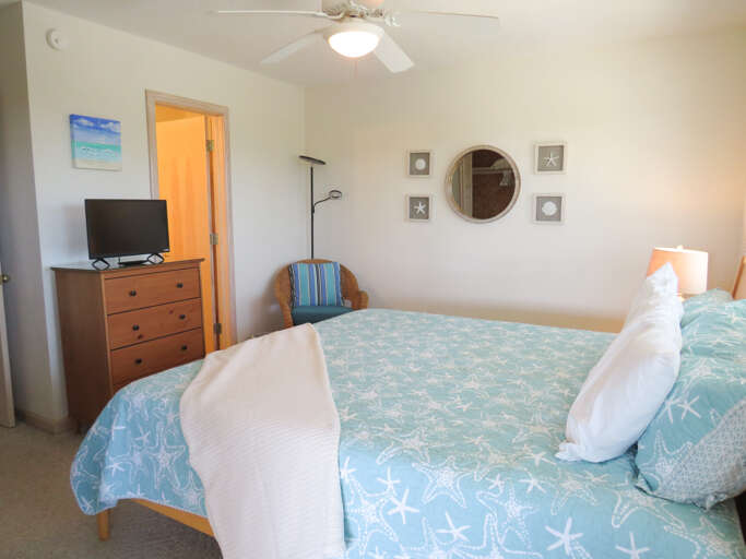 The king bed, en suite and deck access over looking the pool is a wonderful retreat from a day in the sand.