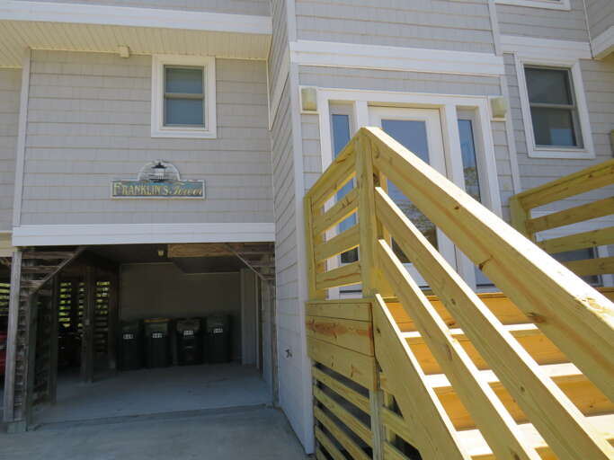 Two car under carriage parking to accompany the long driveway. This front exterior provides enough room for the whole family.