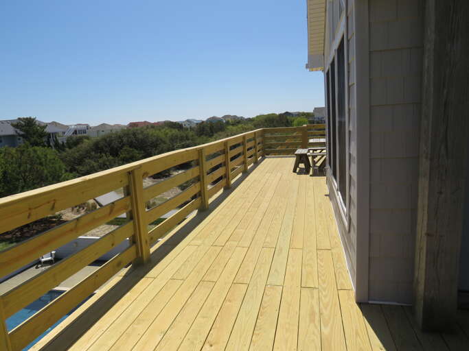 Just off the living room take in the sunrises and beach action with a bird's eye view.