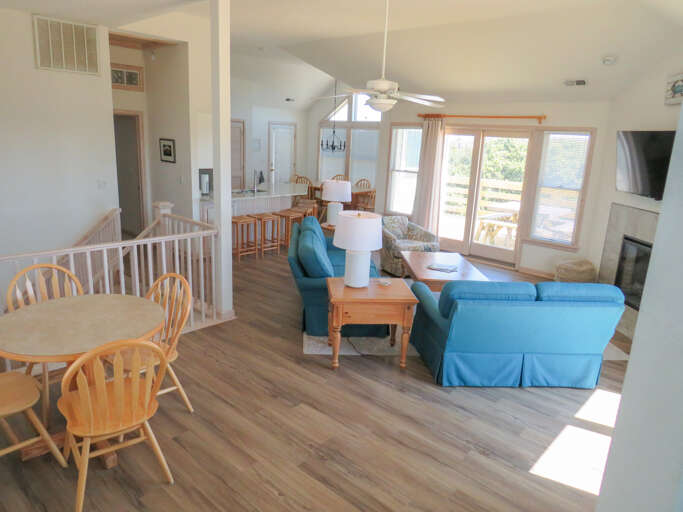 Step down from the sitting room and take in the open concept living space.