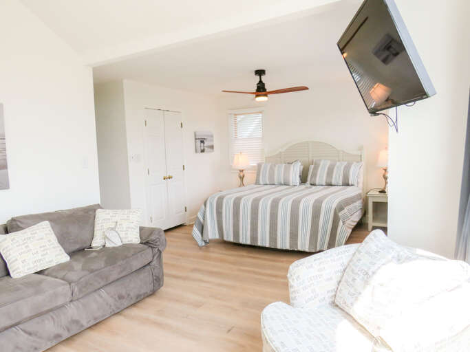 With its own bathroom this king master offers a comfy bed, smart TV and seating area.
