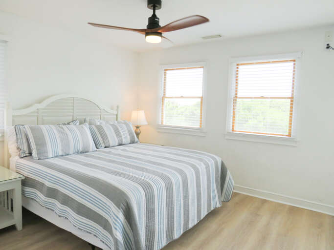 With its own bathroom this king master offers a comfy bed, smart TV and seating area.