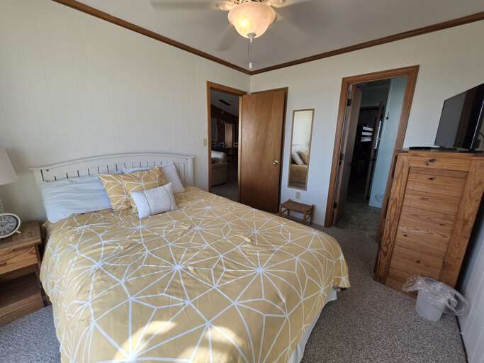 Tranquil bedroom with a queen-sized bed and an ocean view.