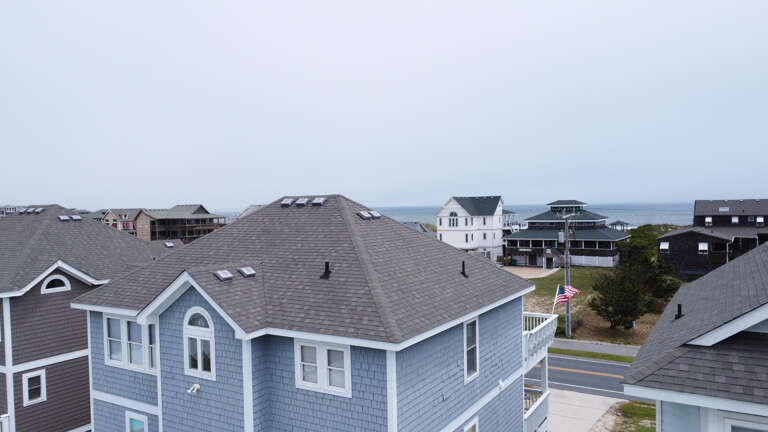 Aerial View Of Residential Buildings Near Coastline
