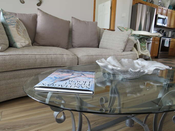 Living Room With Sofa And Glass Coffee Table