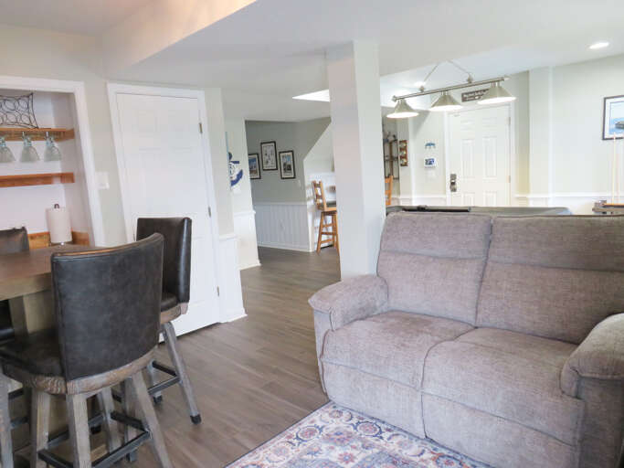 Interior Living Space With Sofa, Dining Area, And Kitchenette
