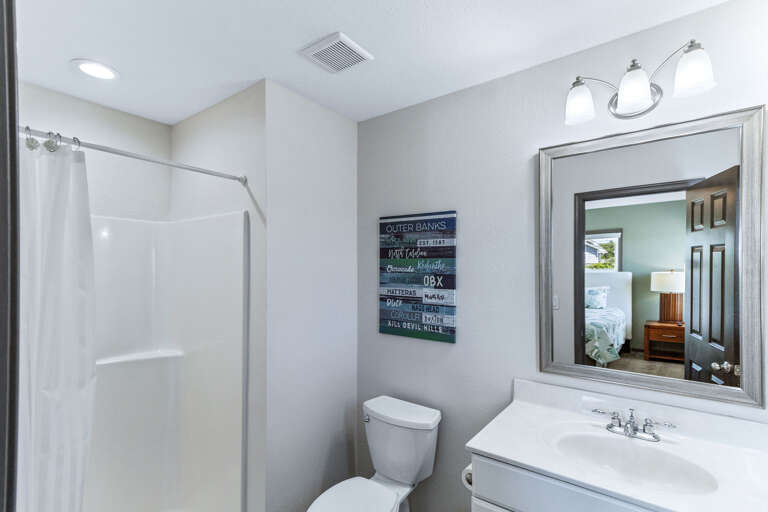 With walk in shower, large vanity sink and just off the king bedroom this private bath s clean and functional.
