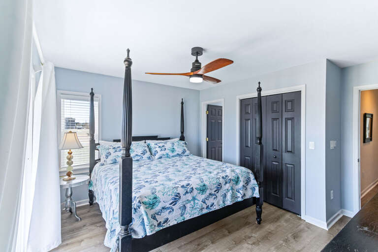 Tranquil bedroom with a king-sized bed, great storage , and an ocean view.