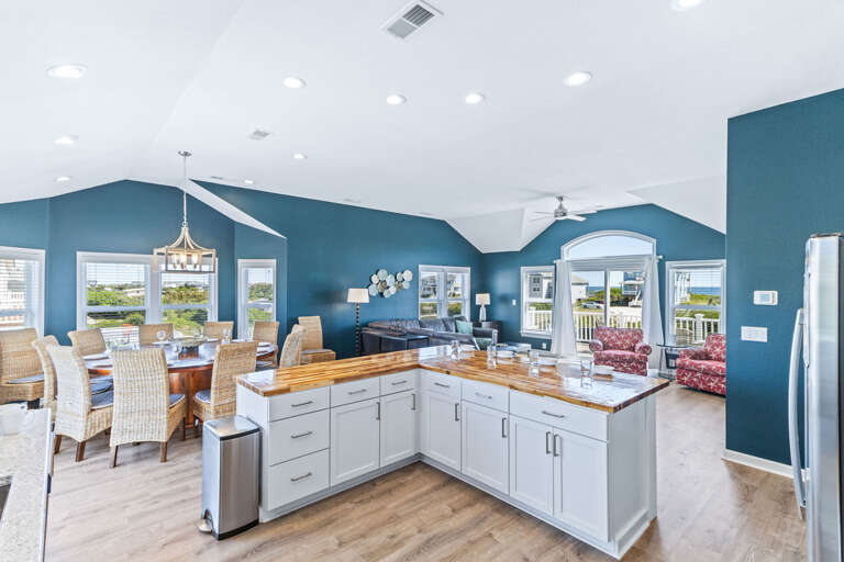 Well-appointed kitchen featuring granite countertops, upgraded appliances, and a breakfast bar, ideal for preparing home-cooked meals.