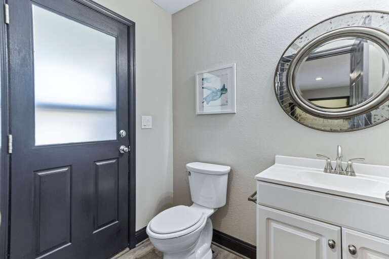 Located on the ground floor just off the pool this half bath provides poolside access  and is close to the laundry room.
