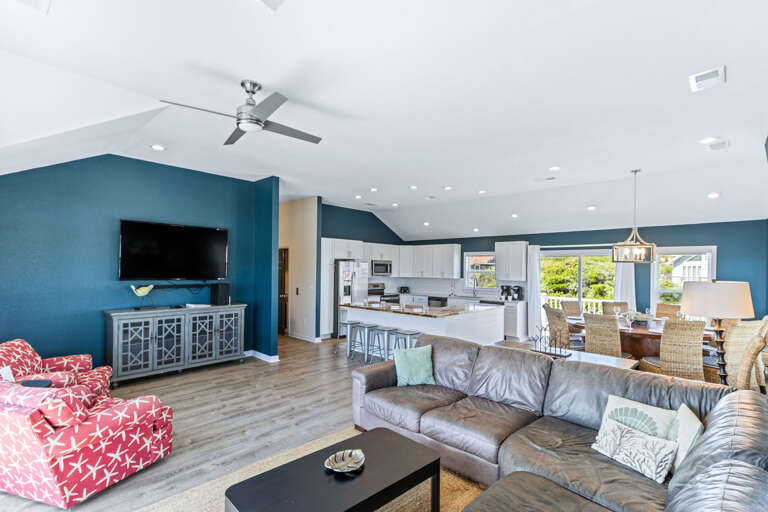 Perfect for unwinding the coastal view, large leather sectional, Smart TV with swivel accent chairs are just a few of the many reasons to cozy up with the family.