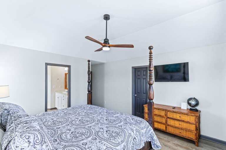 Located on the midlevel this king bedroom with private bath, Smart -TV and private deck with pool view is great for relaxing.