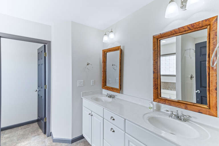 Enjoy the light colors and double vanity in the primary.