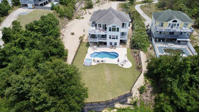 Aerial View Of A Vacation Rental Property With Swimming Pool