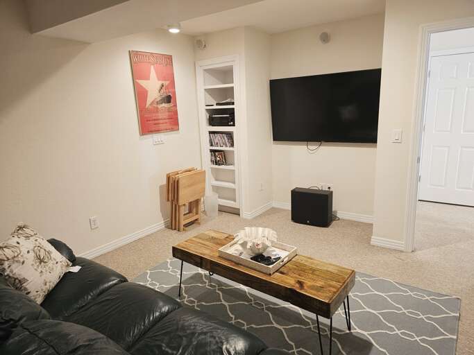 Comfy and cozy leather couches make movie night in Sound Dreams a memorable place to vacation.