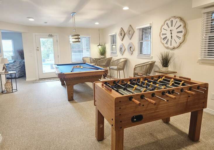 Pool table, foosball table and directors chairs make for a great game room.
