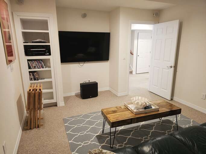 Comfy and cozy leather couches make movie night in Sound Dreams a memorable place to vacation.