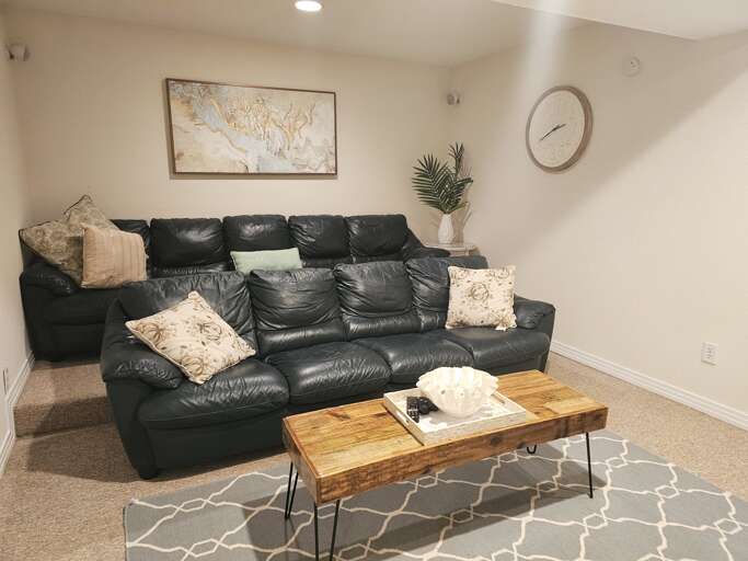 Comfy and cozy leather couches make movie night in Sound Dreams a memorable place to vacation.
