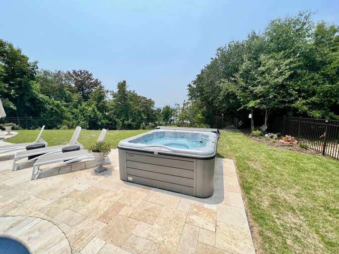 Outdoor Area With Hot Tub And Sun Loungers