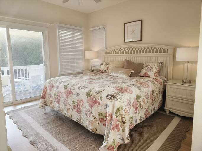 This bright, beautiful and cozy King bedroom is sure to please with an attached bath and balcony access.