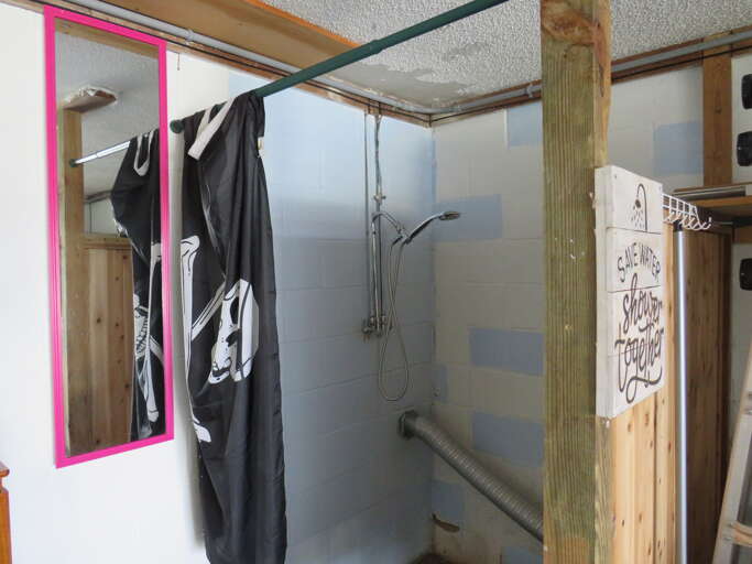Bathroom With Glass Shower And Clothes Hanging Bathroom With Glass Shower And Clothes Hanging