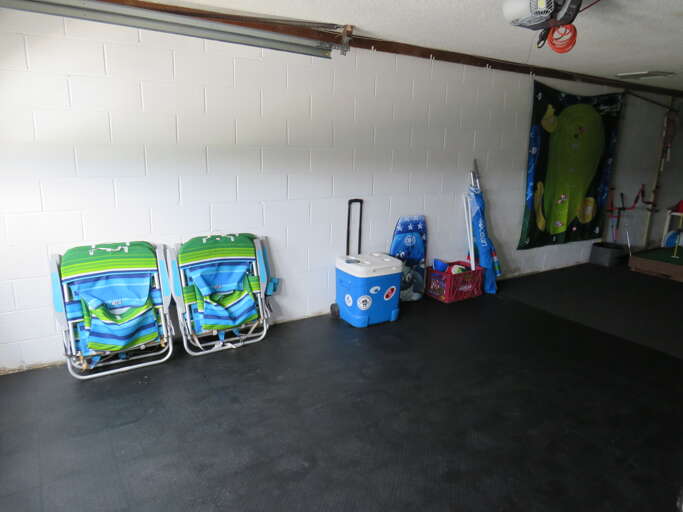 Garage Interior With Chairs And Storage Items Garage Interior With Chairs And Storage Items