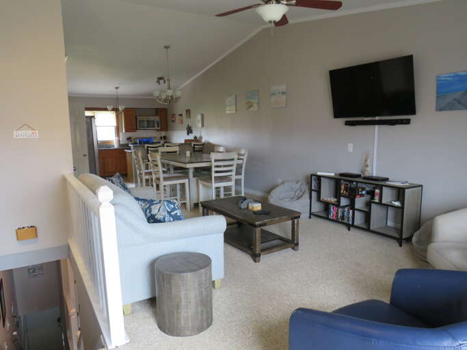 Interior Of A Vacation Rental Living Room With Kitchen In Background Interior Of A Vacation Rental Living Room With Kitchen In Background