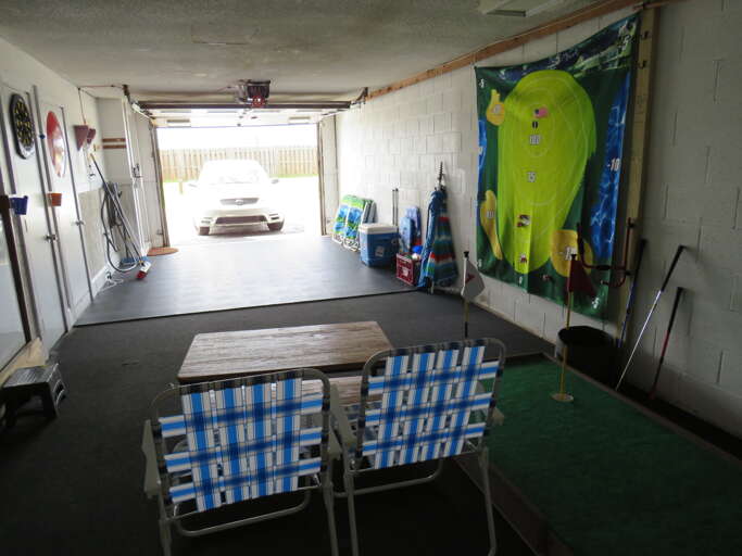 Garage With Surfboards And Chairs Garage With Surfboards And Chairs
