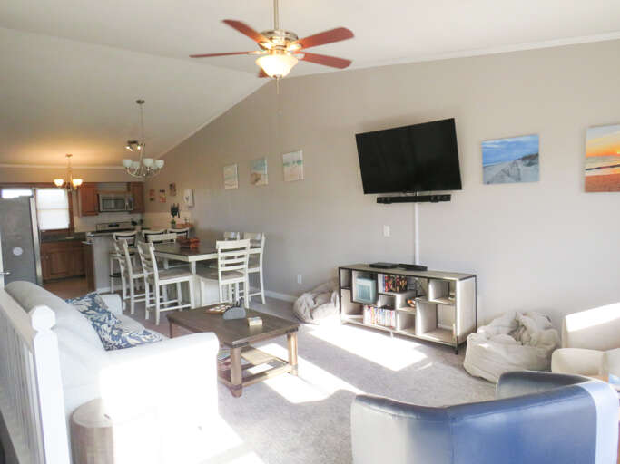 Bright, Breezy Living Space In Vacation Rental With Vaulted Ceiling And Varied Seating