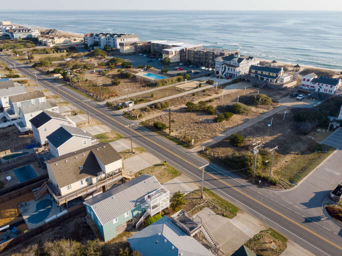 Aerial View Of Coastal Buildings And Road Near The Sea