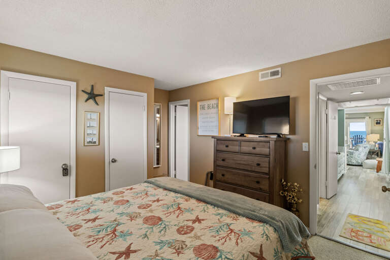 Just to the left of the bathroom this King bedroom is tucked away for privacy and enveloped in comfort.