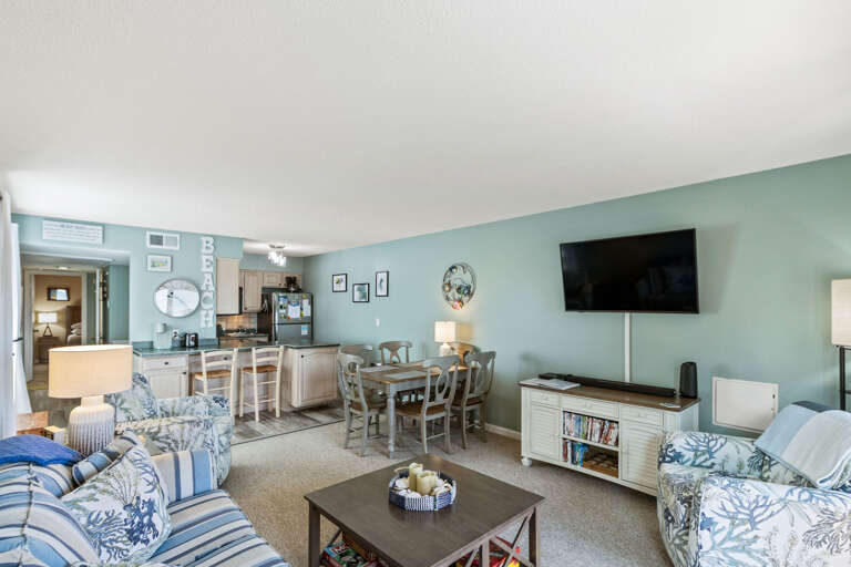 This living room offers sweeping ocean views and is thoughtfully decorated to create a welcoming, open space where you can truly unwind. Large windows allow natural light to flood the room, bringing the beauty of the ocean right inside. The tasteful decor