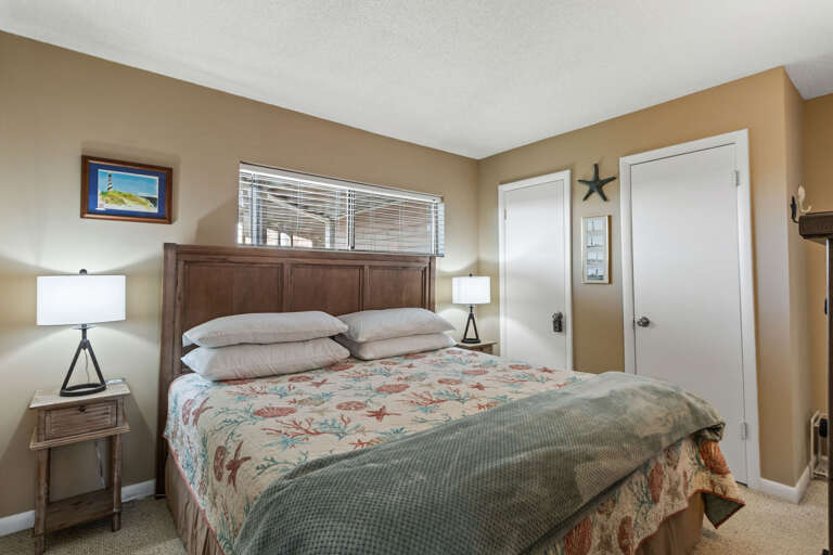 Just to the left of the bathroom this King bedroom is tucked away for privacy and enveloped in comfort.