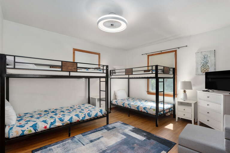 With room for everyone, enjoy this bunk room equipped with a television and games for for kids or adults of all ages.